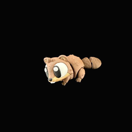 Small brown animal figurine on a dark surface