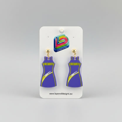 Pair of earrings on a Layered Designs card with a gray background